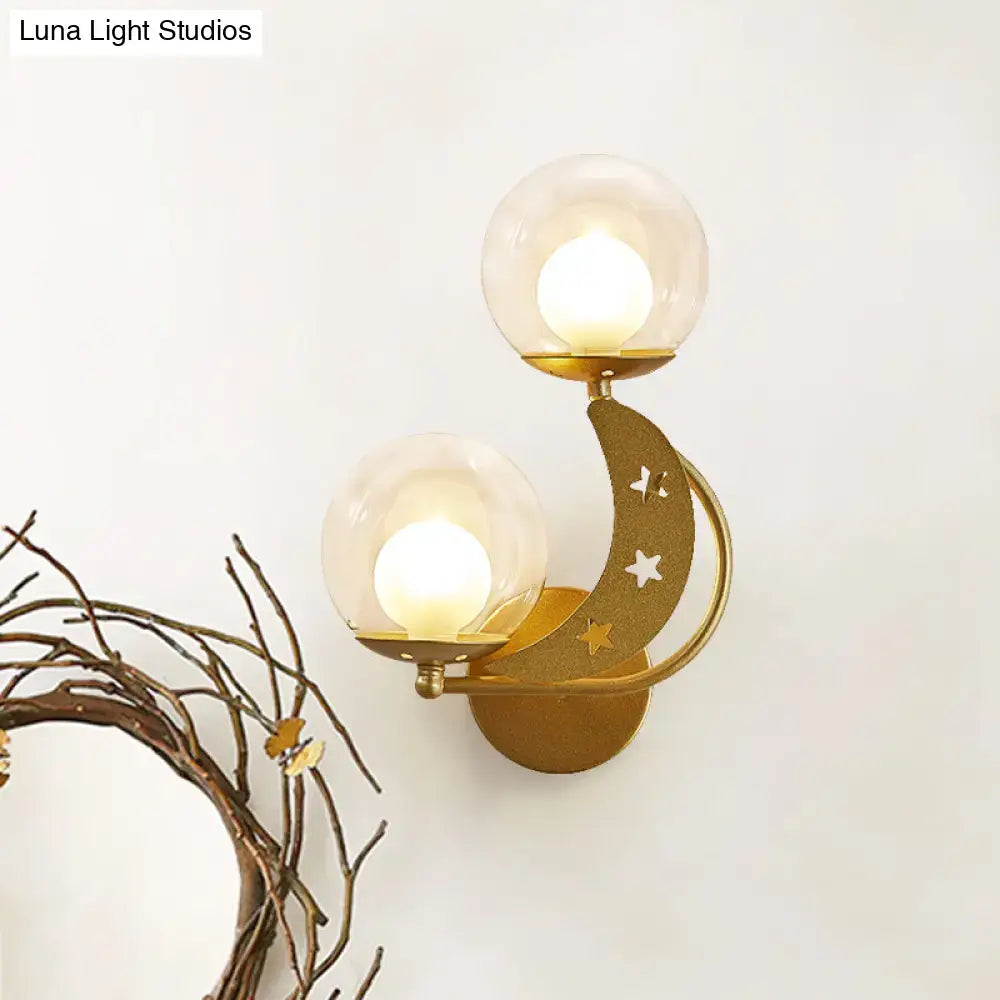 Gold-toned crescent moon wall sconce with cut-out stars and two glass globes modern ball wall sconce for bedroom