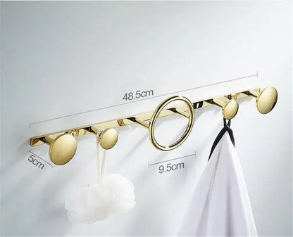 Modern gold and black brass towel hook set with five hooks including one circular ring for bathroom wall hanger