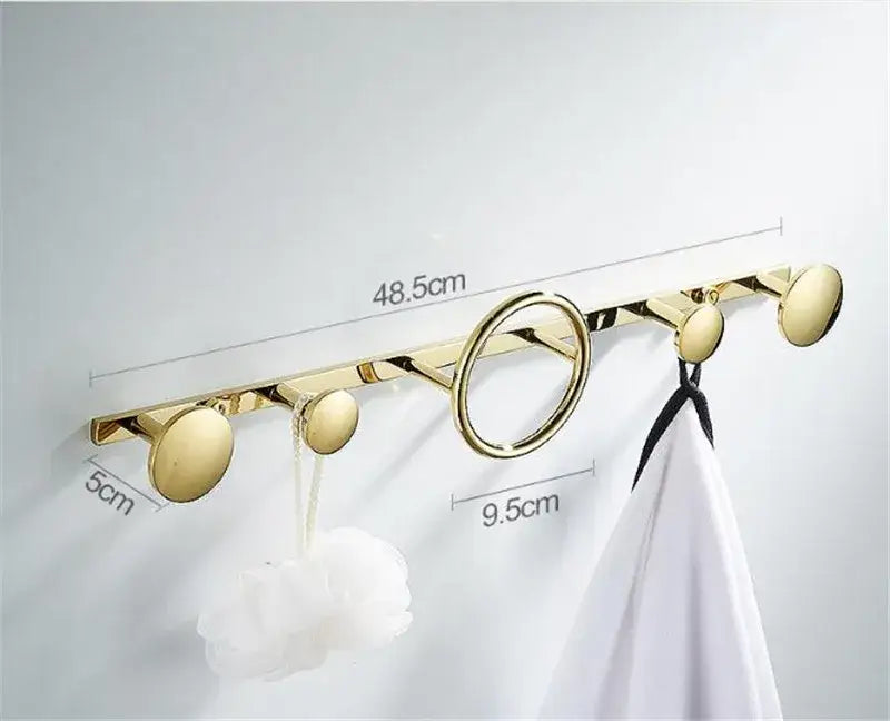 Modern gold and black brass towel hook set with five hooks including one circular ring for bathroom wall hanger