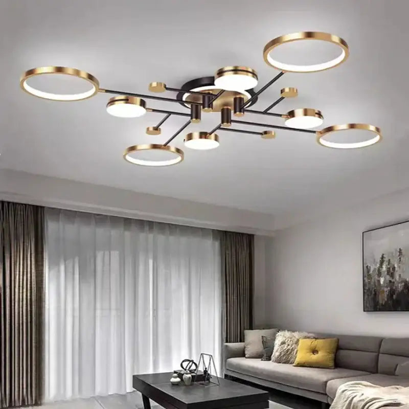 Modern gold black pendant light featuring circular led bulbs with gold rims on a black metal branching frame for living room decorbites gold black
