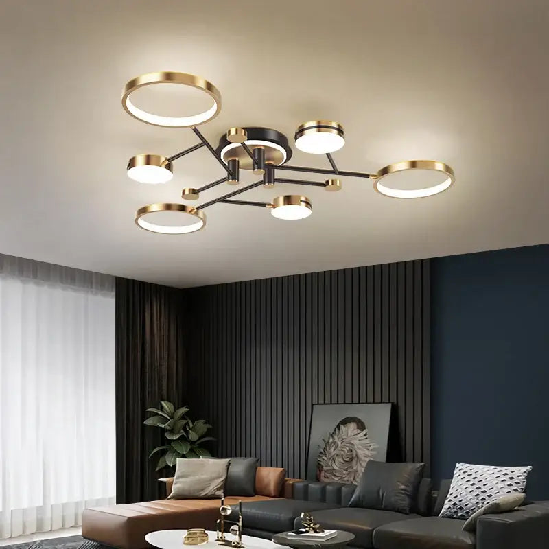 Modern gold black pendant light with sleek black and gold finish featuring asymmetrical circular LED bulbs for living room decorbites gold black