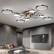 Modern gold black pendant light with multiple illuminated circular rings for living room decorbites gold black design