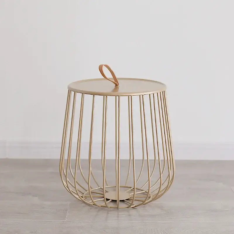 Modern gold wireframe side table with circular top and tan leather handle for coffee table decorbites gold pumpkin style