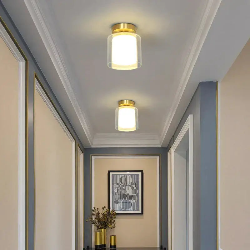 Modern gold black copper led ceiling light with clear glass cylinder housing for living room decorbites black copper design