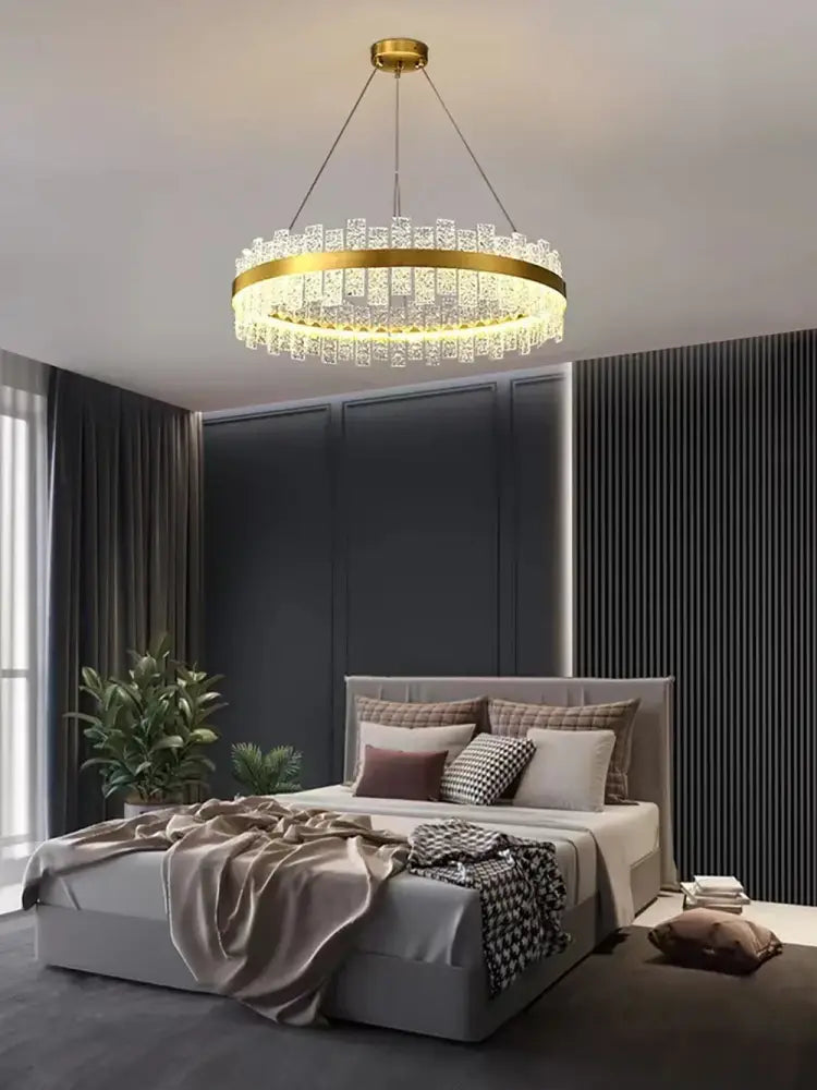 Modern gold and black crystal led chandelier featuring a gold-toned circular design with decorbites crystal accents
