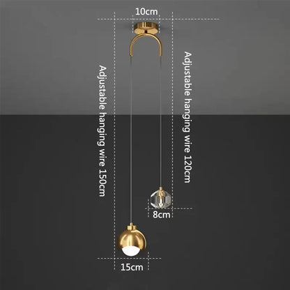 Modern gold and black crystal linear pendant light featuring a gold-finished spherical pendant light with crystal accent and adjustable wire