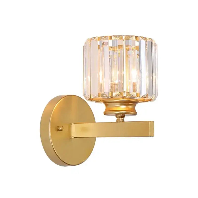 Modern gold and black crystal sconce light with gold finish and faceted cylindrical glass shade decorbites crystal sconce
