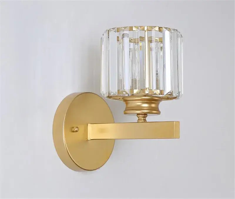 Modern gold and black decorbites crystal sconce light with cylindrical faceted crystal shade for bedroom wall decor