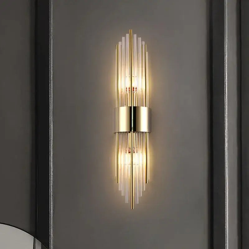 Modern gold and black crystal wall lamp featuring gold-toned vertical glass rods and a central metallic band for living room decorbites crystal wall lamp