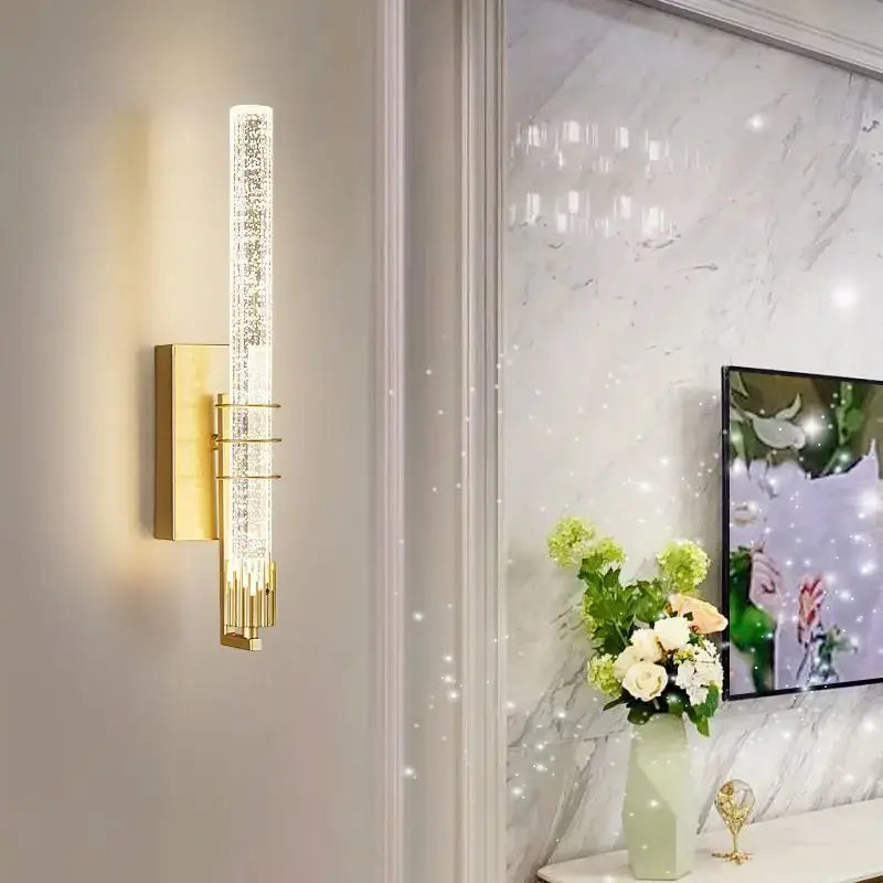 Modern gold and black crystal wall sconce with vertical crystal glass tube and metallic accents for bedroom decorbites crystal wall