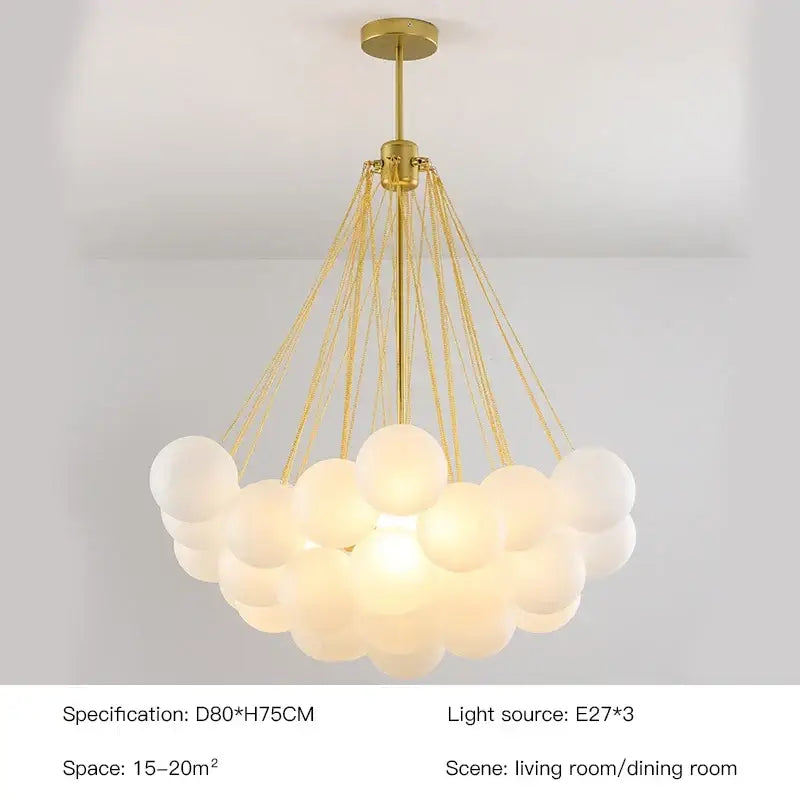 Modern gold and black frosted glass ball chandelier with multiple frosted glass spheres by decorbites for dining room decor