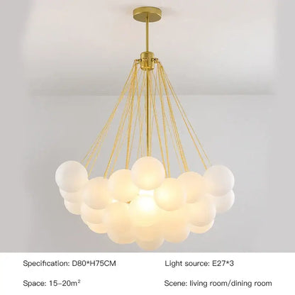 Modern gold and black frosted glass ball chandelier with multiple frosted glass spheres by decorbites for dining room decor