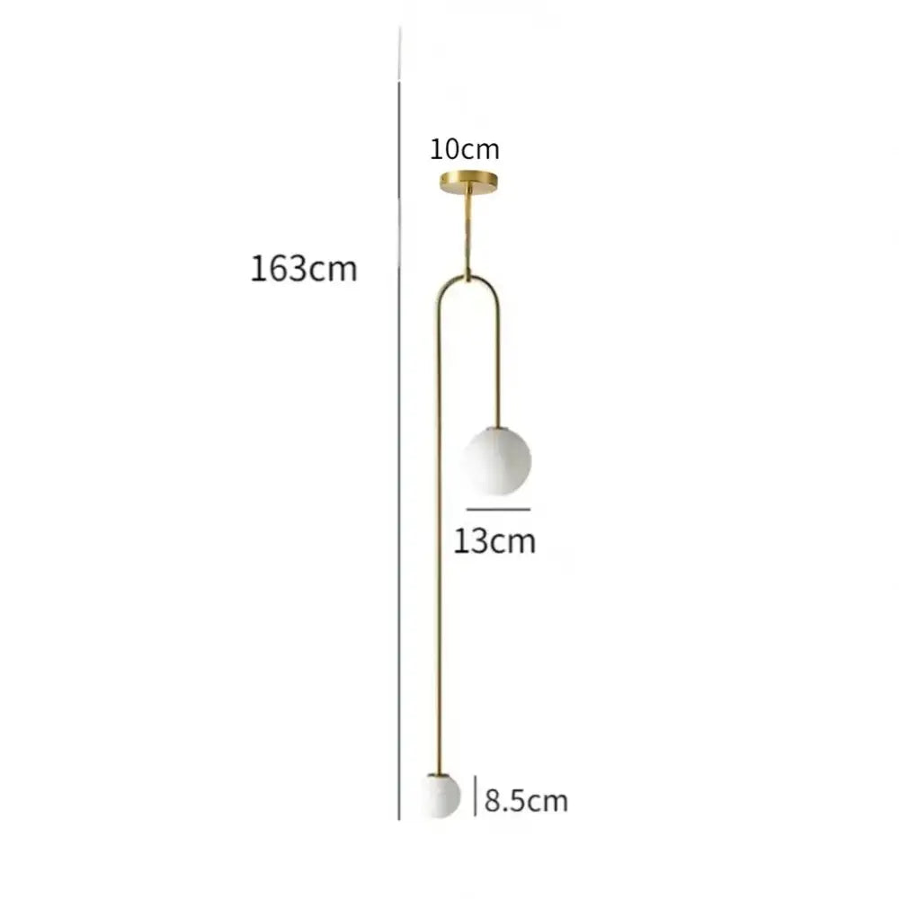Modern pendant light with gold-toned metal detailing and two white glass globe shades for dining room use