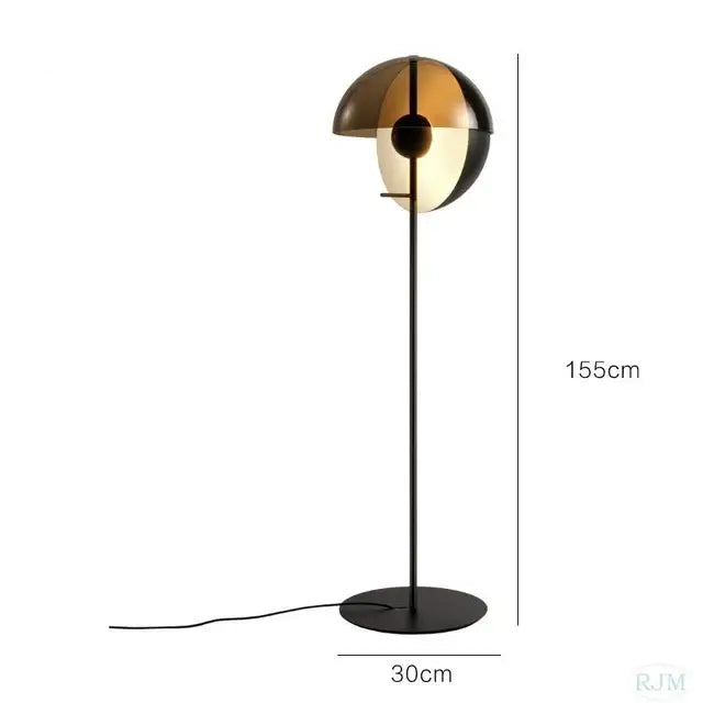 A sleek black floor lamp with decorbites glass hemisphere led featuring amber and gold panels for modern living room decor