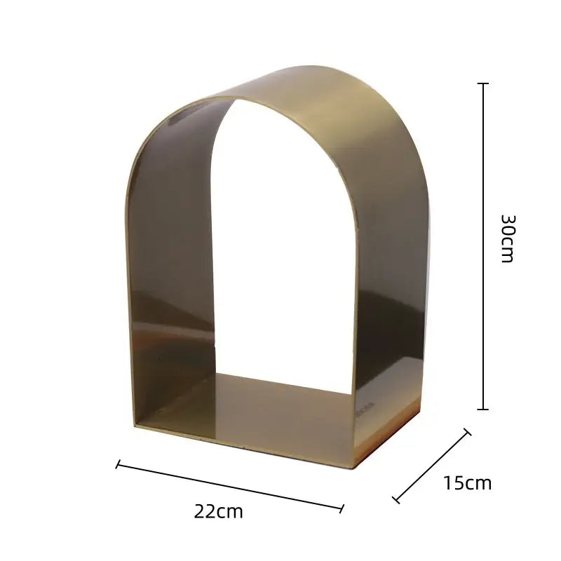 A sleek modern gold and black golden arches metal sculpture bookshelf with a polished brass finish for decorbites decor
