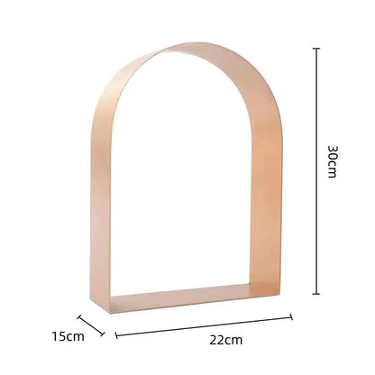 Modern gold and black golden arches metal sculpture bookend with sleek rose gold arched metal shelf base decorbites golden arches
