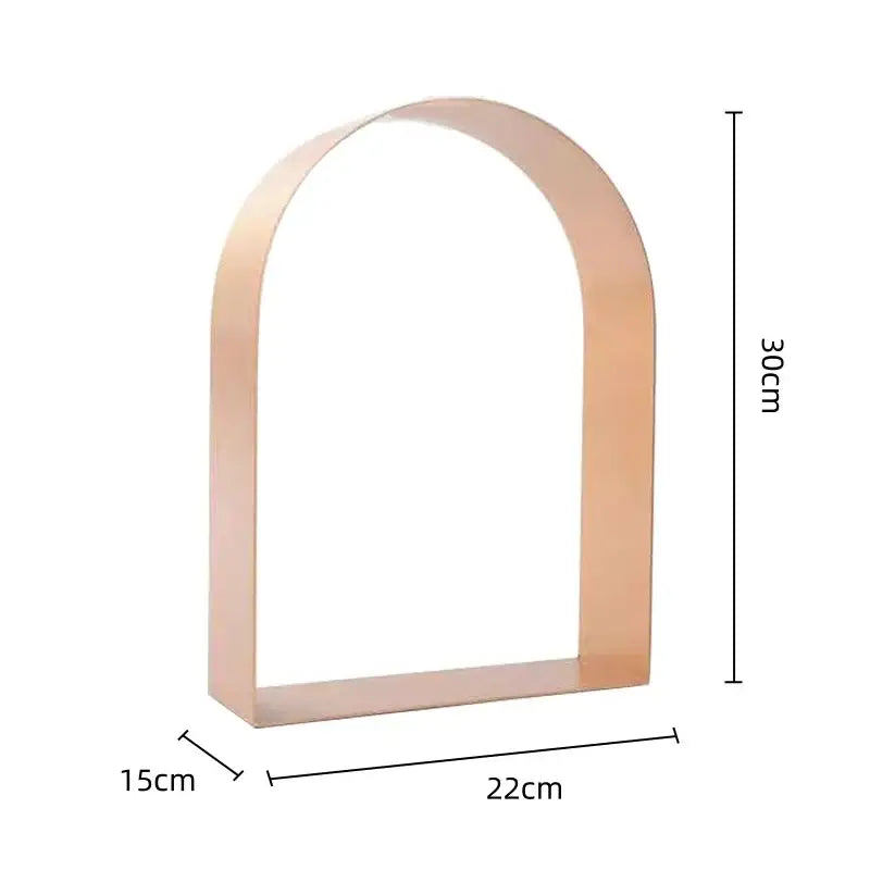 Modern gold and black golden arches metal sculpture bookend with sleek rose gold arched metal shelf base decorbites golden arches