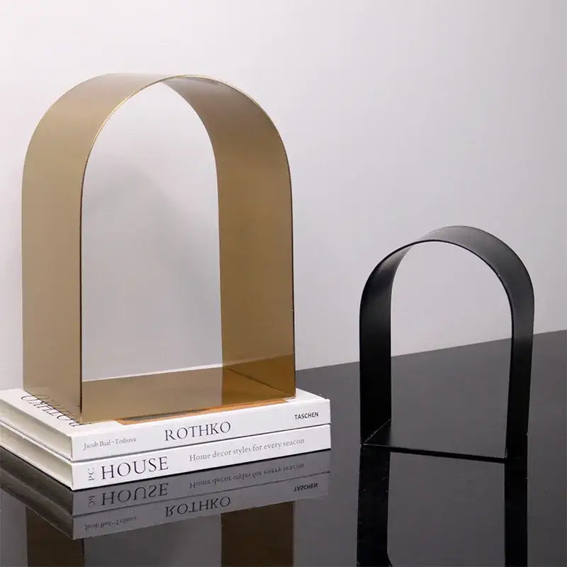 Modern gold and black golden arches metal sculpture bookends with sleek minimalist design for living room decorbites golden arches