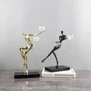 Two sleek gold and black crystal ball golden man figurines for modern living room decor by decorbites golden man