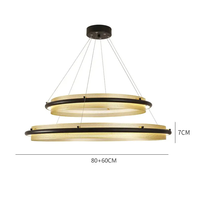 Modern gold and black honeycomb round pendant light with black metal frames and translucent gold mesh panels by decorbites