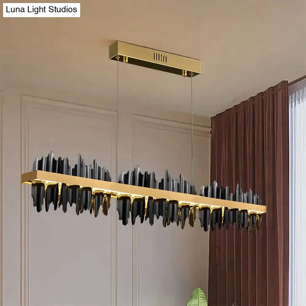 Modern gold and black DecorBites Irene LED chandelier lighting with sleek mountain-like design for dining room use