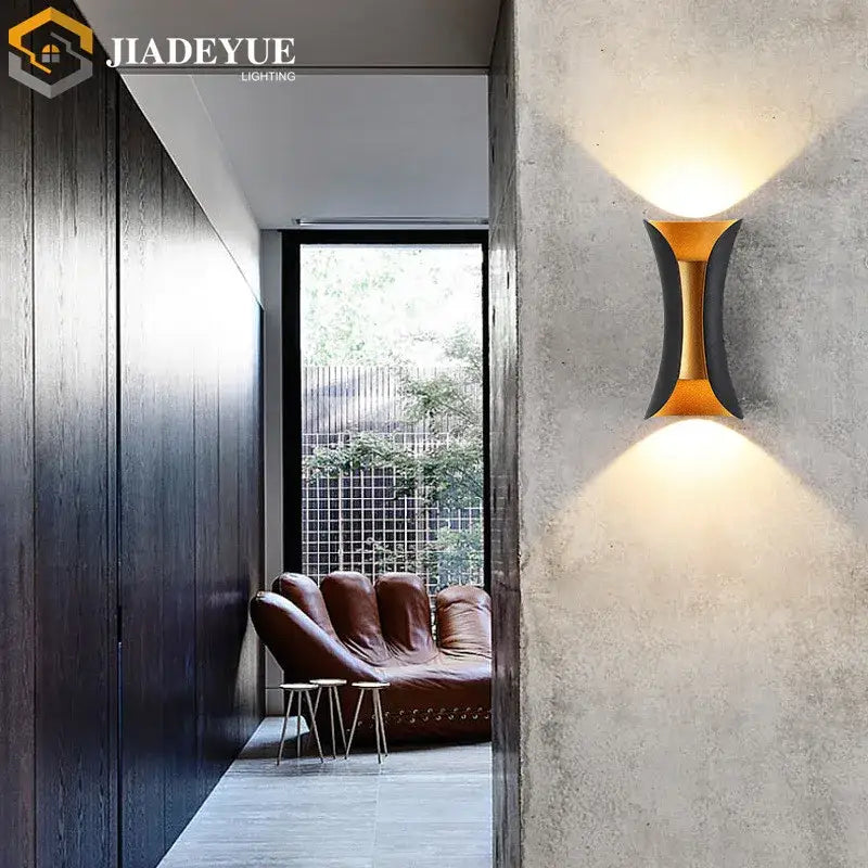 Modern gold and black led wall light with sleek curved design for decorbites led wall garden decor sconce