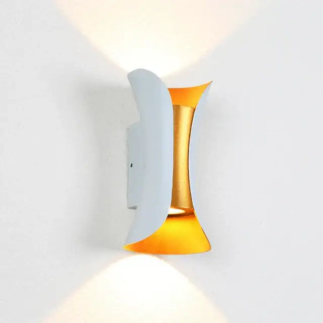 Modern gold and white dual-sided led wall light with curved metallic arms for warm ambient decorbites led wall lighting
