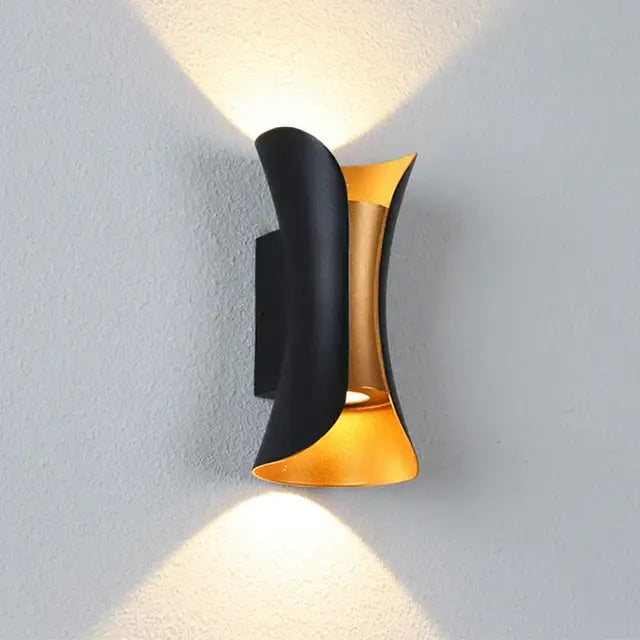 Modern gold and black two-tone led wall light with sleek metallic curves casting warm directional light for decorbites led wall use