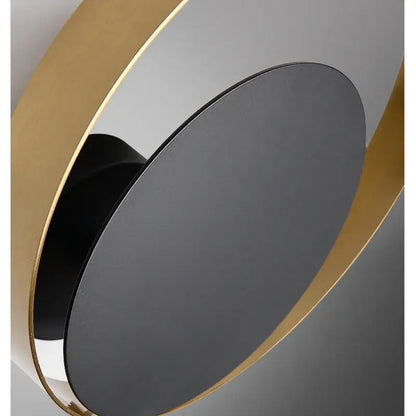 Modern gold and black wall sconce with sleek black matte disc and polished gold rings perfect for elegant led wall decorbites light