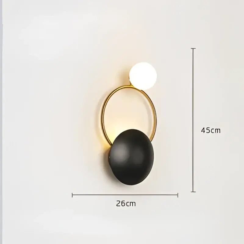 Gold-toned circular wall sconce with matte black spherical base and white globe light for elegant led wall decorbites elegant led