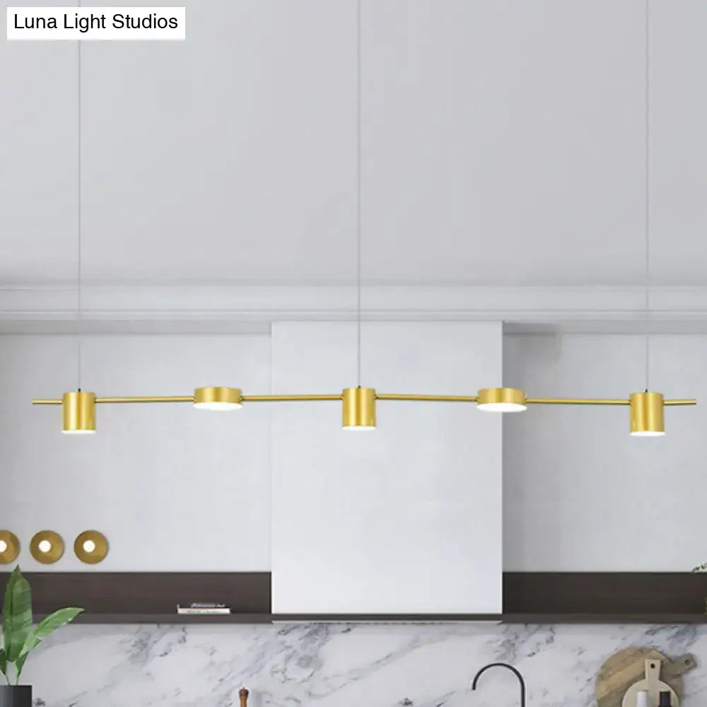 Gold-toned decorbites modern linear chandelier with cylindrical bulbs and rotatable shades in warm white light