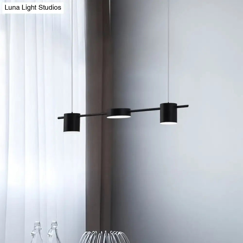 Black cylindrical DecorBites™ modern linear metallic chandelier with three rotatable heads and warm white light