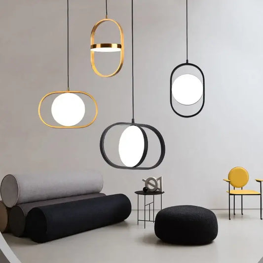 Modern gold and black oval pendant lights with sleek frames and bright white circular bulbs for kitchen decorbites pendant lights