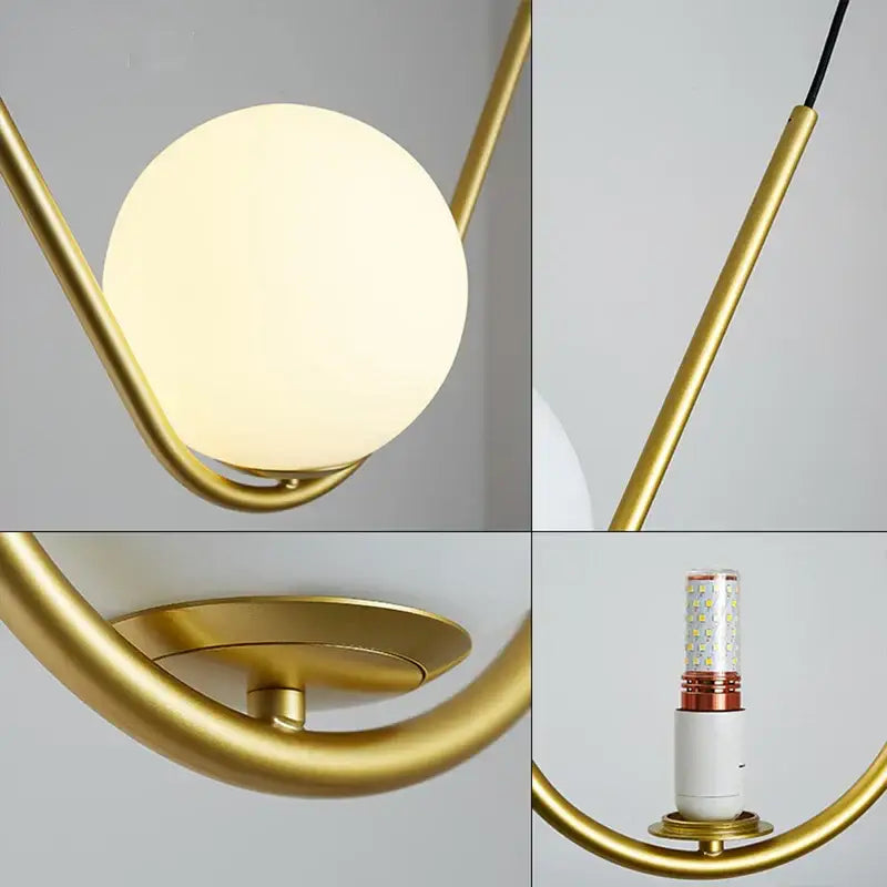 Modern gold and black pendant light with frosted glass globe and sleek metal frame for dining room decorbites golden black perle