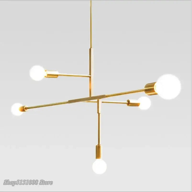 Modern gold and black finish pendant light with five white spherical bulbs in decorbites cross style for dining room decor