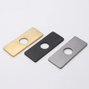 Three rectangular metal cover deck plates in gold black and brushed silver with central circular hole for kitchen faucet