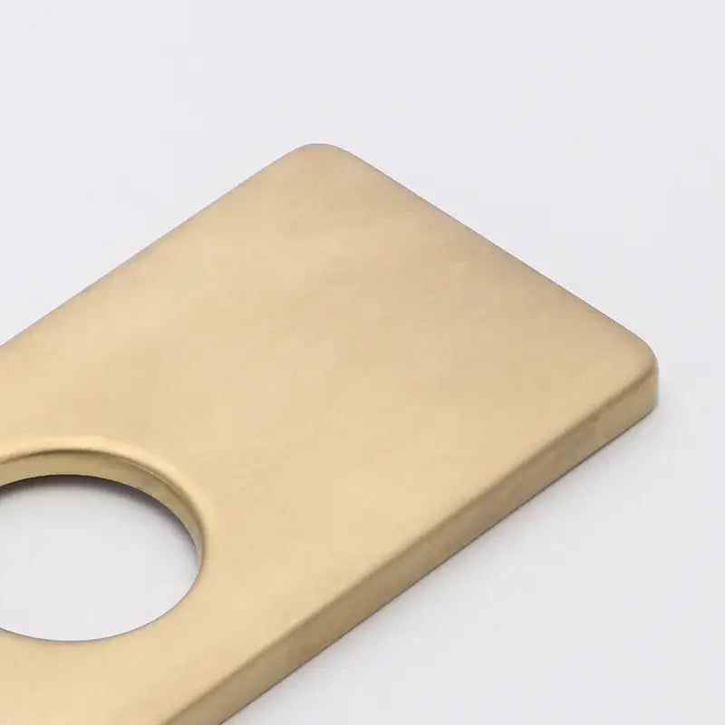 Gold-colored rectangular metal deck plate with circular cutout hole cover deck for kitchen faucet accessory