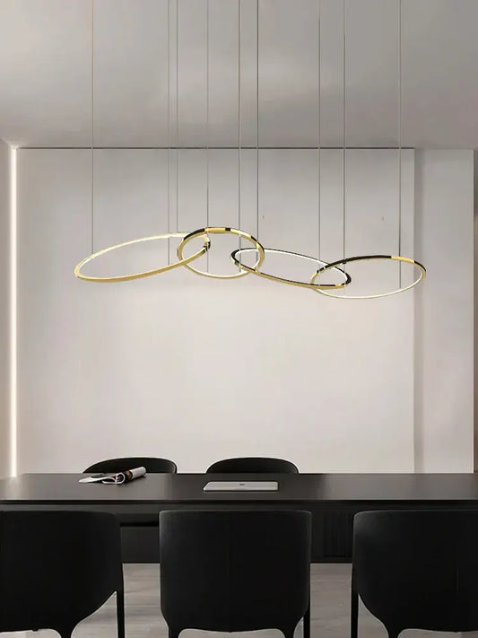 Modern gold and black stainless steel pendant lights with sleek interlocking ring design for dining room decorbites gold stainless