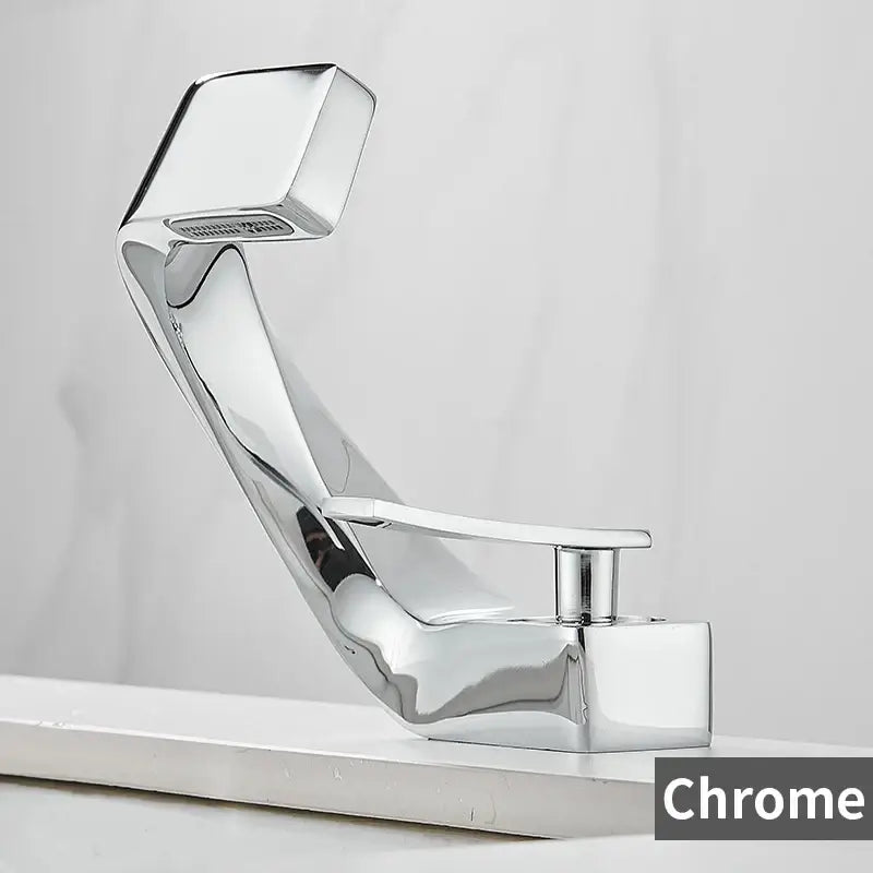 Modern gold and black waterfall basin faucet with chrome finish and sleek angular design featuring integrated showerhead
