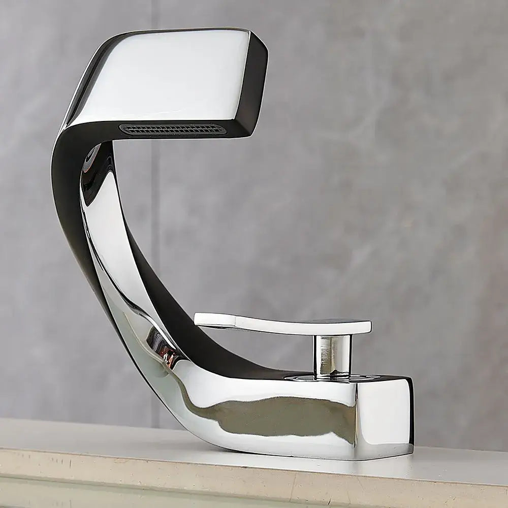 Modern gold and black waterfall basin faucet with chrome finish sleek curved design and rectangular spout for bathroom use