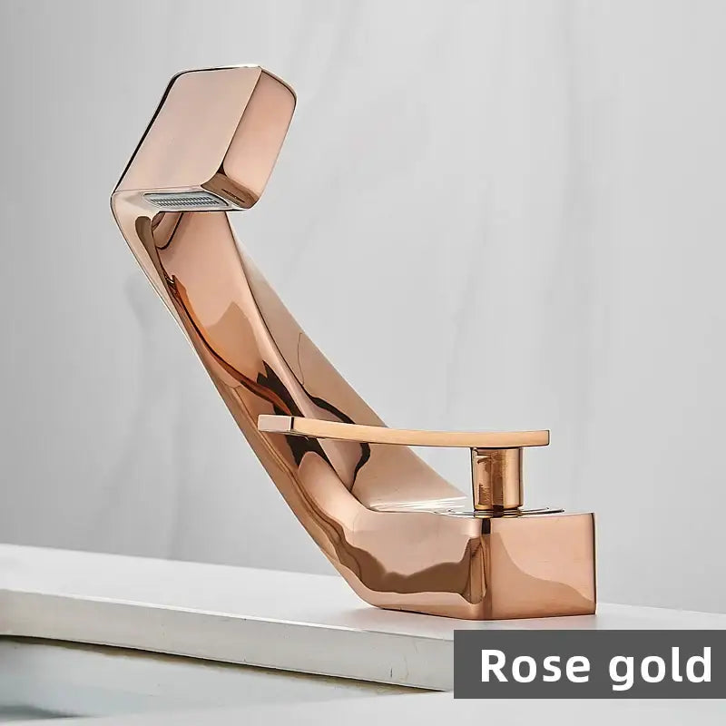 Modern gold and black waterfall basin faucet with rose gold sleek angular design and polished metallic finish for bathroom