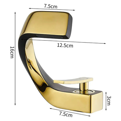 Modern gold and black two-tone waterfall basin faucet with sleek curved design for bathroom fixtures