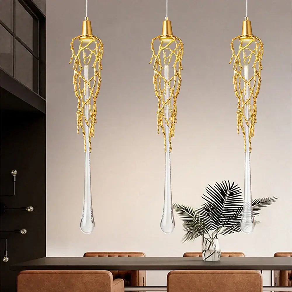 Three elegant gold branch art cage pendant lights with woven wire and crystal shades in modern dining room decorbites branch art