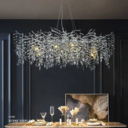 Modern gold branch crystal chandelier with clear crystal leaves and LED lights for elegant dining room decorbites branch crystal