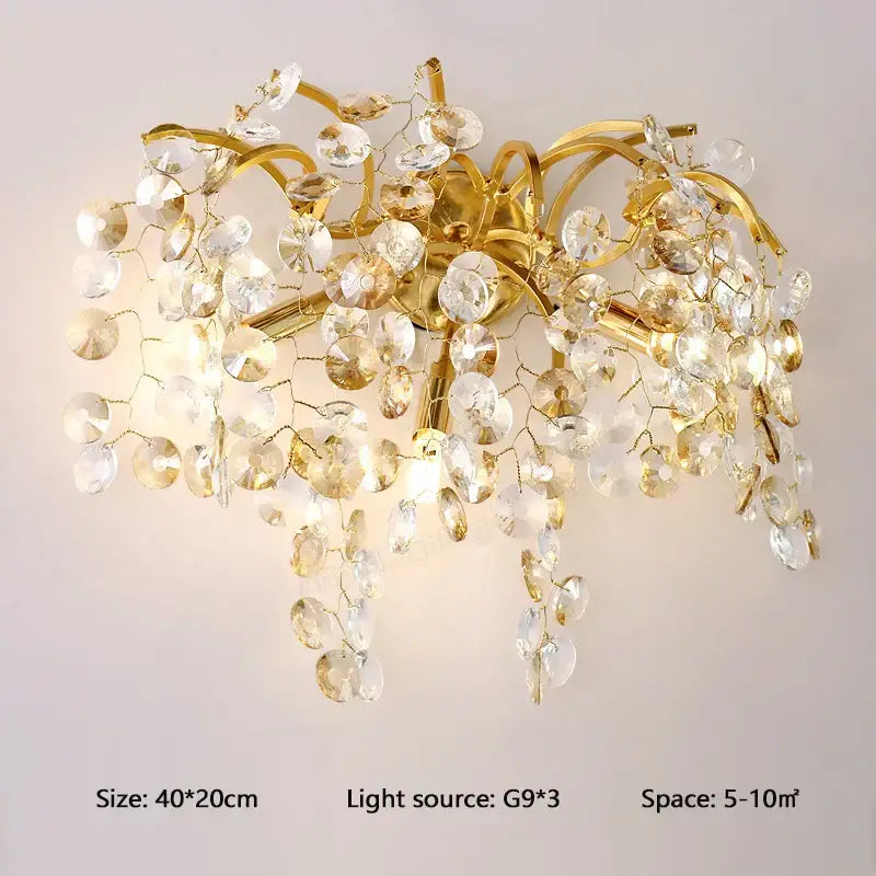 Modern gold branch crystal led wall light with gold-toned crystal led decorbites and cascading amber glass pieces