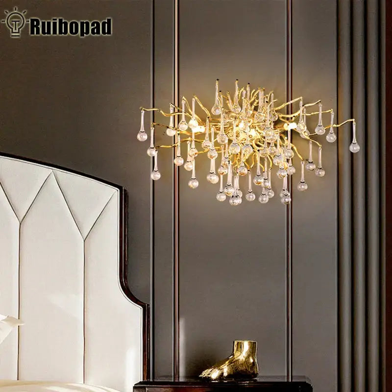 Modern gold branch crystal led wall light featuring gold-toned metal and dangling crystal droplets for living room decorbites crystal led