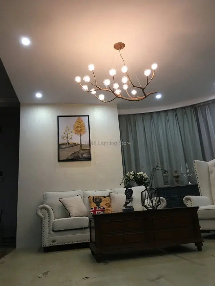 Modern gold branch glass bubble resin pendant light with warm-toned spherical bulbs for dining room decorbites glass bubble