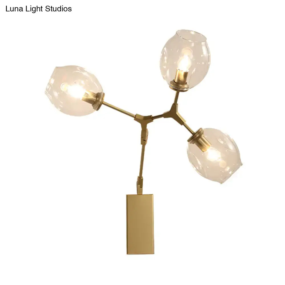 Modern gold branch wall lamp with three frosted glass globe shades for living room lighting and decor