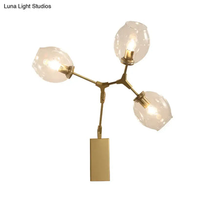 Modern gold branch wall lamp with three frosted glass globe shades for living room lighting and decor