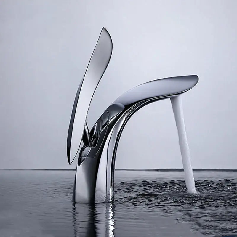 Modern gold brass basin faucet with sleek chrome finish and flowing high-heeled shoe design decorbites brass basin